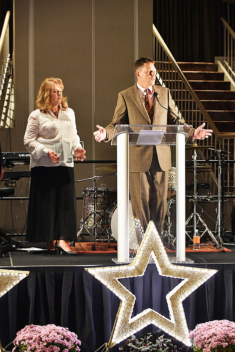 Diana and Dean Kohmann at the podium